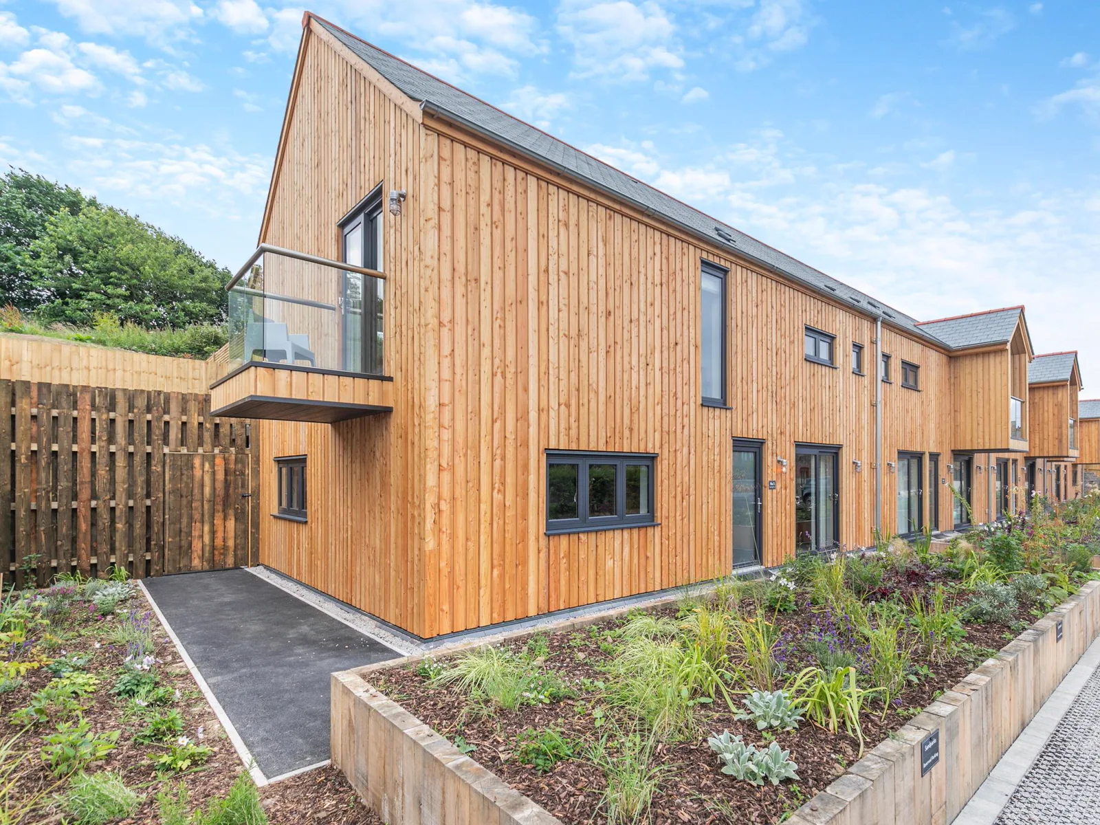 Gwari Spa Barn 3.0 — contemporary luxury lodge with floor-to-ceiling windows and private hot tub