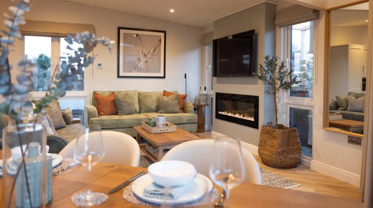 Inside a Trelowen lodge at Whalesborough — open-plan living and dining